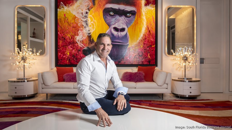 Grant Cardone in a branded, high-energy office environment