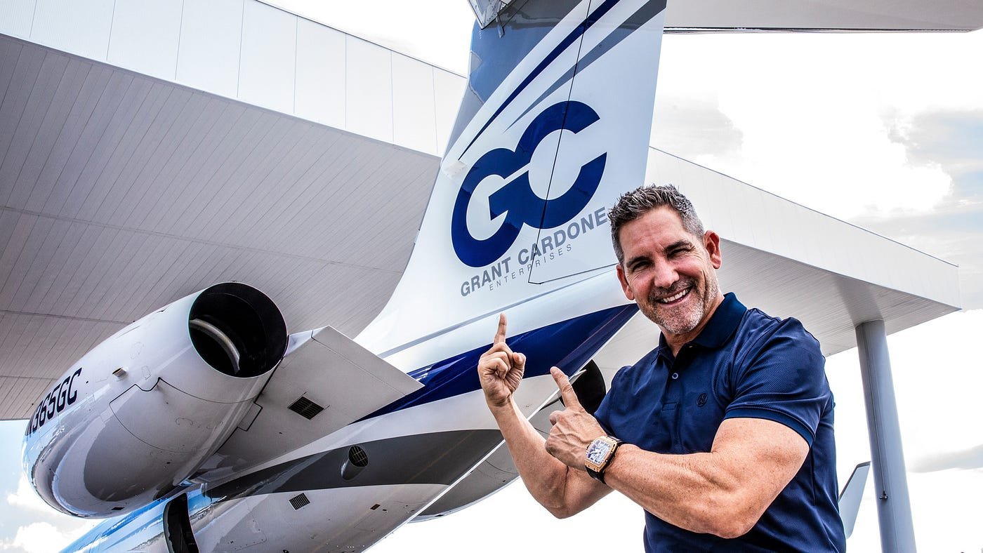 Grant Cardone near a private jet